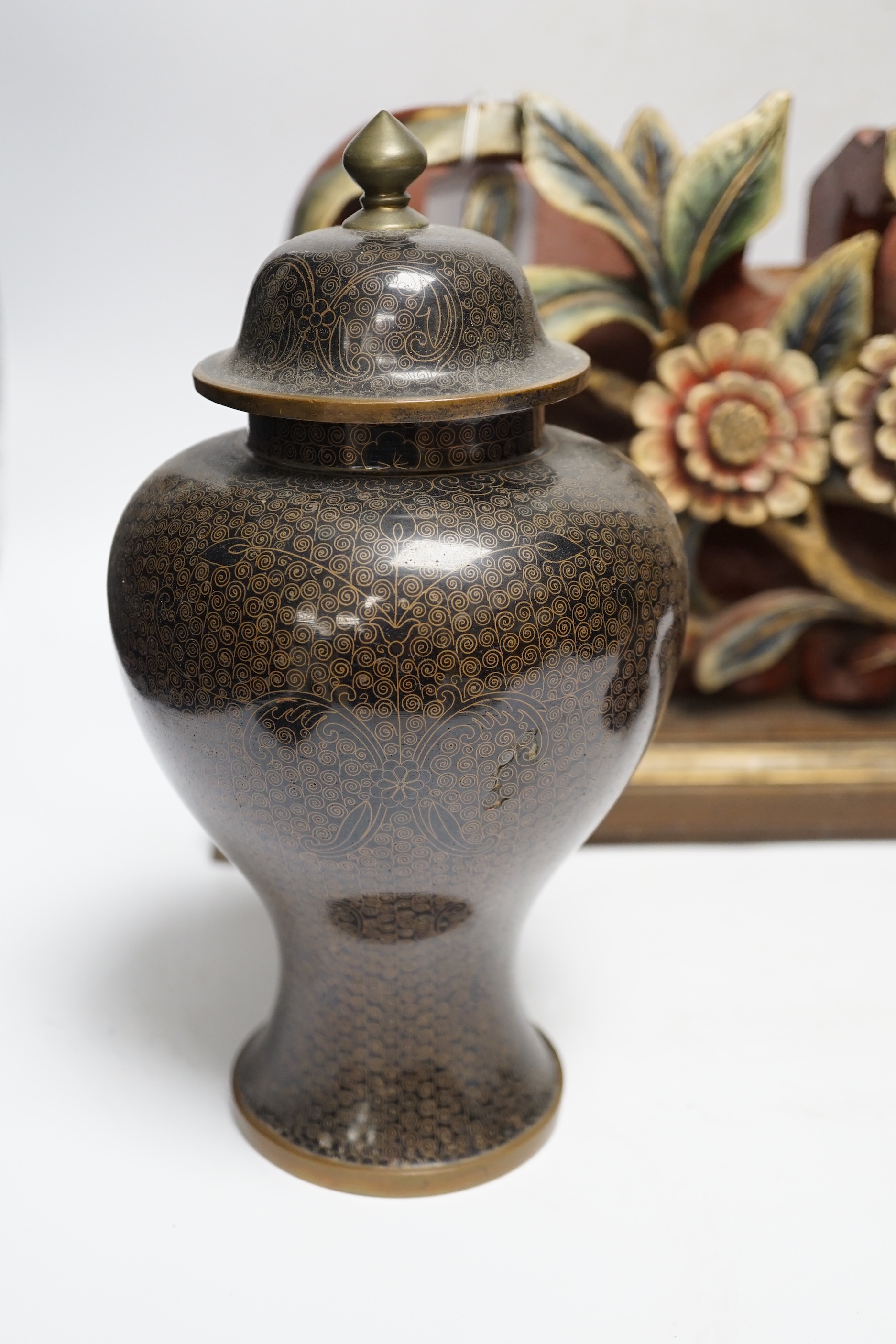 A Chinese floral wooden carving, 40cm wide, together with a Chinese cloisonné enamel vase and cover, 25cm tall, and a Chinese Yixing redware teapot